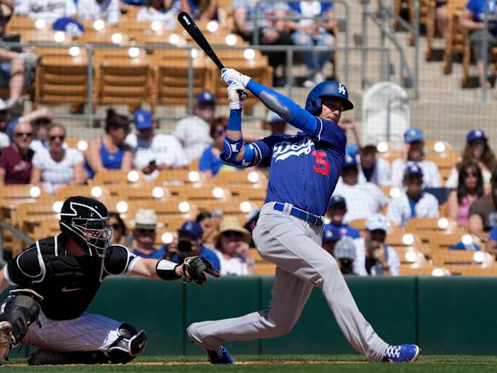 Mar 21, 2022; Phoenix, Arizona, USA; Los Angeles Dodgers center fielder Cody Bellinger (35) strikes out in the second inning during a spring training game against the Chicago White Sox at Camelback Ranch-Glendale.